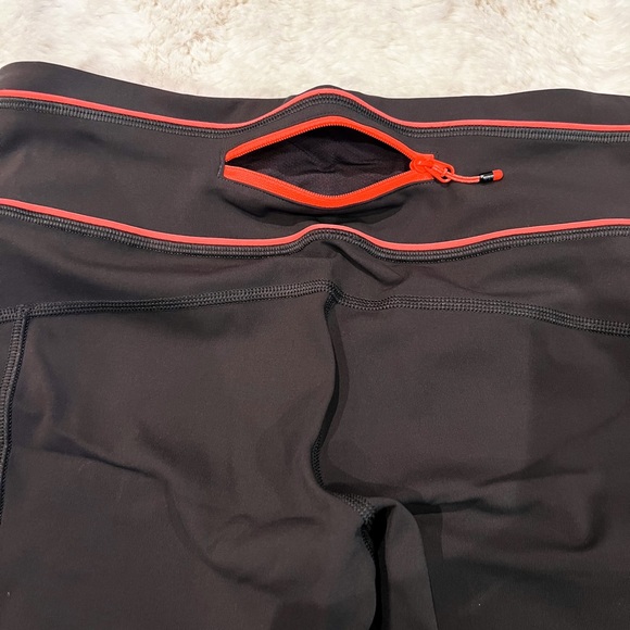 Lululemon capris. Like new. Barely worn. Size 6. Dark grey with coral. - Picture 6 of 10
